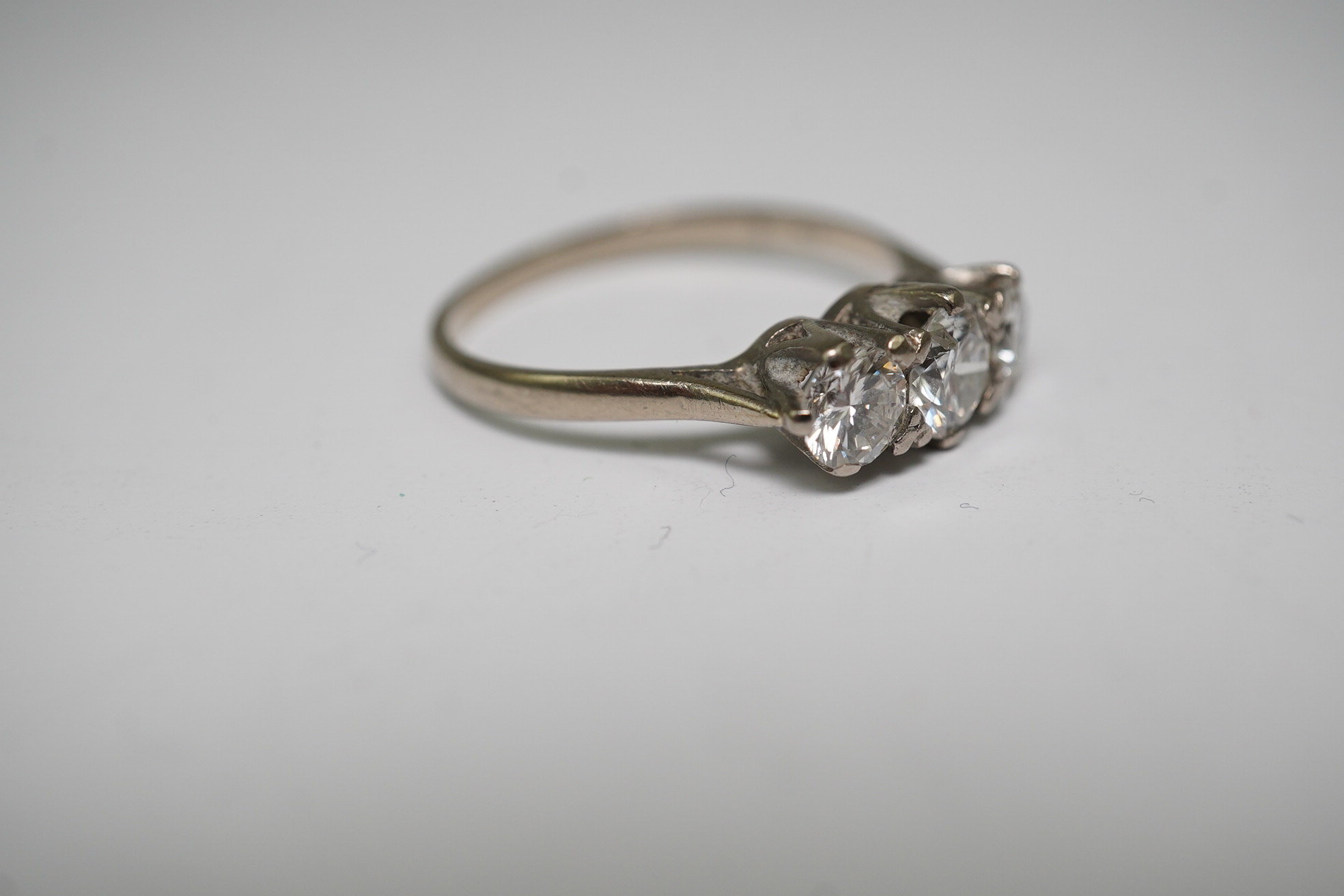 An 18ct white gold and three stone diamond set ring